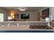 Gas range with granite countertops and decorative backsplash in a modern kitchen at 3008 Blue Fin Cir, Las Vegas, NV 89128
