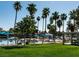 Sandy lagoon area with palm trees, umbrellas, and seating at 3008 Blue Fin Cir, Las Vegas, NV 89128