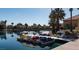 Scenic waterfront view with colorful paddle boats and nearby houses at 3008 Blue Fin Cir, Las Vegas, NV 89128