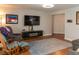 Living room featuring a comfortable seating arrangement, TV, and modern decor at 3008 Blue Fin Cir, Las Vegas, NV 89128