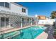 Beautiful backyard featuring a sparkling swimming pool and covered patio, perfect for relaxing and entertaining outdoors at 3008 Blue Fin Cir, Las Vegas, NV 89128
