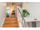 Open foyer showcasing a staircase with steel railing and wood treads, illuminated by a modern ceiling fan at 3008 Blue Fin Cir, Las Vegas, NV 89128
