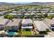 A beautiful home with a private backyard featuring a pool, patio, and lush green lawn, perfect for outdoor living at 3042 Echoed Rondel Ln, Henderson, NV 89044