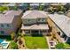 Stunning backyard with a covered patio, lush green lawn, and cozy seating area, creating an ideal outdoor retreat at 3042 Echoed Rondel Ln, Henderson, NV 89044