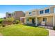 A spacious backyard with artificial turf, covered patio with grill, and outdoor seating at 3042 Echoed Rondel Ln, Henderson, NV 89044