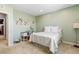 Cozy bedroom featuring a bed and desk area with carpet flooring at 3042 Echoed Rondel Ln, Henderson, NV 89044