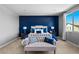 Beautiful bedroom featuring an accent wall, carpet, sitting area and a view at 3042 Echoed Rondel Ln, Henderson, NV 89044