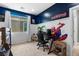 ' bedroom featuring a bright blue accent wall and a modern desk at 3042 Echoed Rondel Ln, Henderson, NV 89044