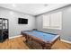 Well lit game room featuring a billiard table, wine rack, and mounted TV at 3042 Echoed Rondel Ln, Henderson, NV 89044