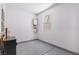 Garage corner with epoxy flooring, a small window, and a wall-mounted tankless water heater at 3042 Echoed Rondel Ln, Henderson, NV 89044