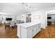 Open concept kitchen and dining area with spacious island at 3042 Echoed Rondel Ln, Henderson, NV 89044