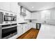 Modern kitchen featuring stainless steel appliances, white cabinetry, and counter tops at 3042 Echoed Rondel Ln, Henderson, NV 89044