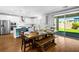 Spacious layout showcasing the kitchen, dining area, and backyard access at 3042 Echoed Rondel Ln, Henderson, NV 89044