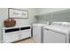 Well-equipped laundry room with modern washer and dryer at 3042 Echoed Rondel Ln, Henderson, NV 89044
