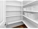 Walk-in pantry featuring bright white shelving and ample storage space at 3042 Echoed Rondel Ln, Henderson, NV 89044