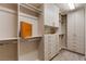 Spacious walk-in closet with custom shelving, drawers and a luxury finish out at 3042 Echoed Rondel Ln, Henderson, NV 89044
