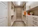 Walk-in closet featuring ample custom shelving, drawers and hanging rods at 3042 Echoed Rondel Ln, Henderson, NV 89044