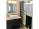 Modern bathroom featuring a vessel sink, stylish vanity, and a glass-enclosed shower at 3329 Hidden Ridge St, Las Vegas, NV 89129