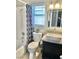 Bathroom featuring a modern sink and vanity, with a shower-tub combo at 3329 Hidden Ridge St, Las Vegas, NV 89129