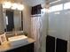 Bright bathroom featuring a vessel sink, stylish vanity, and a glass-enclosed shower at 3329 Hidden Ridge St, Las Vegas, NV 89129