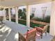 Inviting covered patio area with seating and artificial grass, perfect for outdoor enjoyment at 3329 Hidden Ridge St, Las Vegas, NV 89129