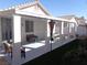 Spacious covered patio with seating and artificial turf, ideal for outdoor gatherings at 3329 Hidden Ridge St, Las Vegas, NV 89129