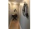 Hallway adorned with decorative wall art and a stylish accent table at 3329 Hidden Ridge St, Las Vegas, NV 89129