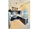 Stylish kitchen featuring stainless steel appliances, granite countertops, and dark cabinetry at 3329 Hidden Ridge St, Las Vegas, NV 89129