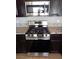 Modern kitchen equipped with stainless steel appliances, including a range and microwave at 3329 Hidden Ridge St, Las Vegas, NV 89129