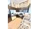 Well-lit kitchen featuring stainless steel appliances, granite countertops, and stylish dark cabinetry at 3329 Hidden Ridge St, Las Vegas, NV 89129