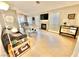Open living room featuring tile floors, a fireplace, and a dining area at 3329 Hidden Ridge St, Las Vegas, NV 89129