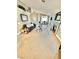Bright living room featuring tile floors, a cozy fireplace, and a comfortable seating area at 3329 Hidden Ridge St, Las Vegas, NV 89129