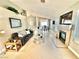 Open living room features comfortable seating, fireplace, and plenty of natural light at 3329 Hidden Ridge St, Las Vegas, NV 89129