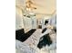 Comfortable main bedroom with ceiling fan, walk-in closet, and ensuite bathroom access at 3329 Hidden Ridge St, Las Vegas, NV 89129