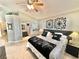 Comfortable main bedroom boasts a ceiling fan and decorative accents on the walls at 3329 Hidden Ridge St, Las Vegas, NV 89129