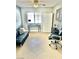 Home office with a comfortable sofa, desk and office chair, and ample storage space at 3329 Hidden Ridge St, Las Vegas, NV 89129