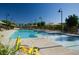 Inviting community pool area with ample seating and shaded umbrellas for relaxation at 3430 Oristano Ln, Henderson, NV 89044
