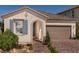 Charming single-story home with blue shutters, a two-car garage, and a covered entrance at 3430 Oristano Ln, Henderson, NV 89044