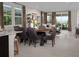 Open concept living area with large windows, neutral decor, and a dining area at 3430 Oristano Ln, Henderson, NV 89044