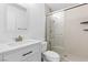 Modern bathroom with marble vanity, brushed gold faucet, and sleek glass shower enclosure at 356 Clark Dr, Henderson, NV 89074