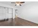 Bedroom featuring hardwood floors, closet dresser, and a door that opens to another room at 356 Clark Dr, Henderson, NV 89074