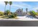 Charming two-story home with a three-car garage and well-maintained landscaping with palm trees at 356 Clark Dr, Henderson, NV 89074