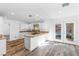 Modern kitchen with granite countertops, white cabinets, and backyard access at 356 Clark Dr, Henderson, NV 89074