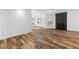 Spacious living room with wood-look floors and a modern fireplace feature at 356 Clark Dr, Henderson, NV 89074