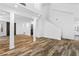 Bright living space with wood-look floors, white walls, and stairs to the second floor at 356 Clark Dr, Henderson, NV 89074