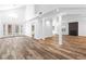 Bright and airy living room with wood-look floors, a fireplace, and double doors to the backyard at 356 Clark Dr, Henderson, NV 89074