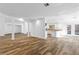 Open concept living area with wood-look floors and easy access to the kitchen and backyard at 356 Clark Dr, Henderson, NV 89074