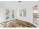 Cozy sunroom with wood-look floors, natural light, and access to the backyard at 356 Clark Dr, Henderson, NV 89074