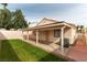 Backyard features a covered patio, small lawn, and a privacy fence at 368 Legacy Dr, Henderson, NV 89014