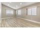 Inviting bedroom with ample natural light from the windows and wood-look floors at 368 Legacy Dr, Henderson, NV 89014